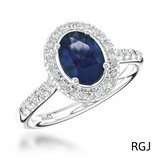 The Skye Platinum 0.74ct Oval Cut Blue Sapphire Ring With 0.35ct Diamond Halo And Diamond Set Shoulders