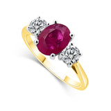 18ct Yellow And White Gold 1.48ct Oval Cut Ruby And 0.55ct Round Brilliant Cut Diamond Three Stone Ring