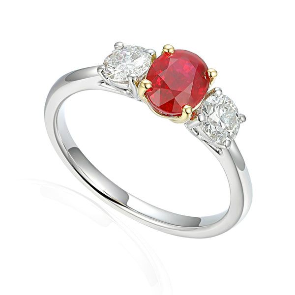 Platinum And 18ct Yellow Gold 1.21ct Oval Cut Ruby And 0.58ct Round Brilliant Cut Diamond Three Stone Ring