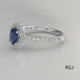 The Skye Platinum 1.43ct Oval Cut Blue Sapphire Ring With 0.41ct Diamond Halo And Diamond Set Shoulders